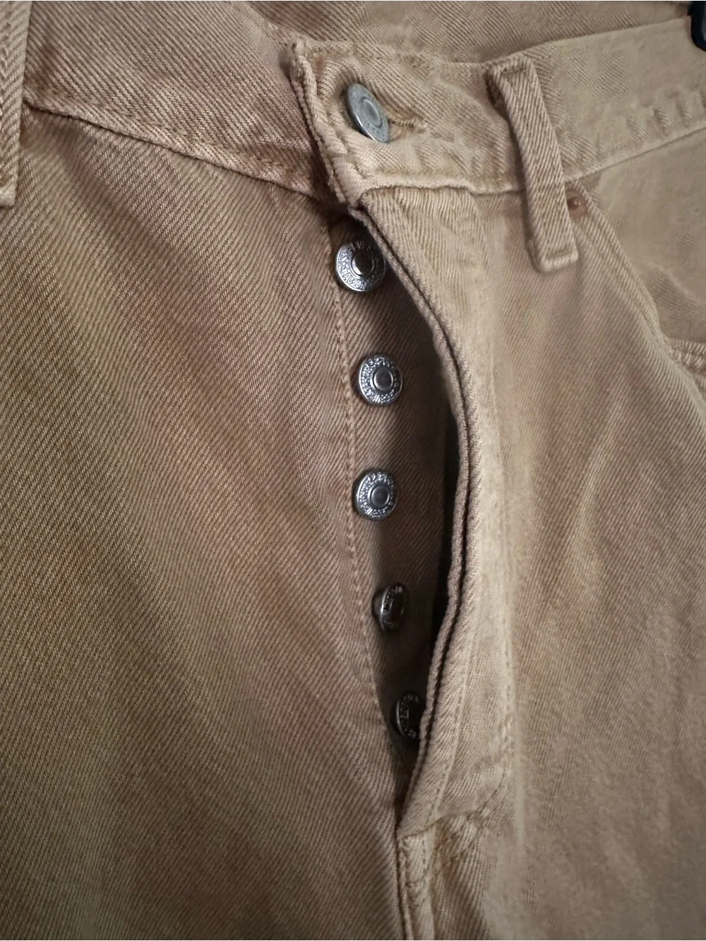 vintage Levi's 501 brown denim jeans featuring a classic button fly
